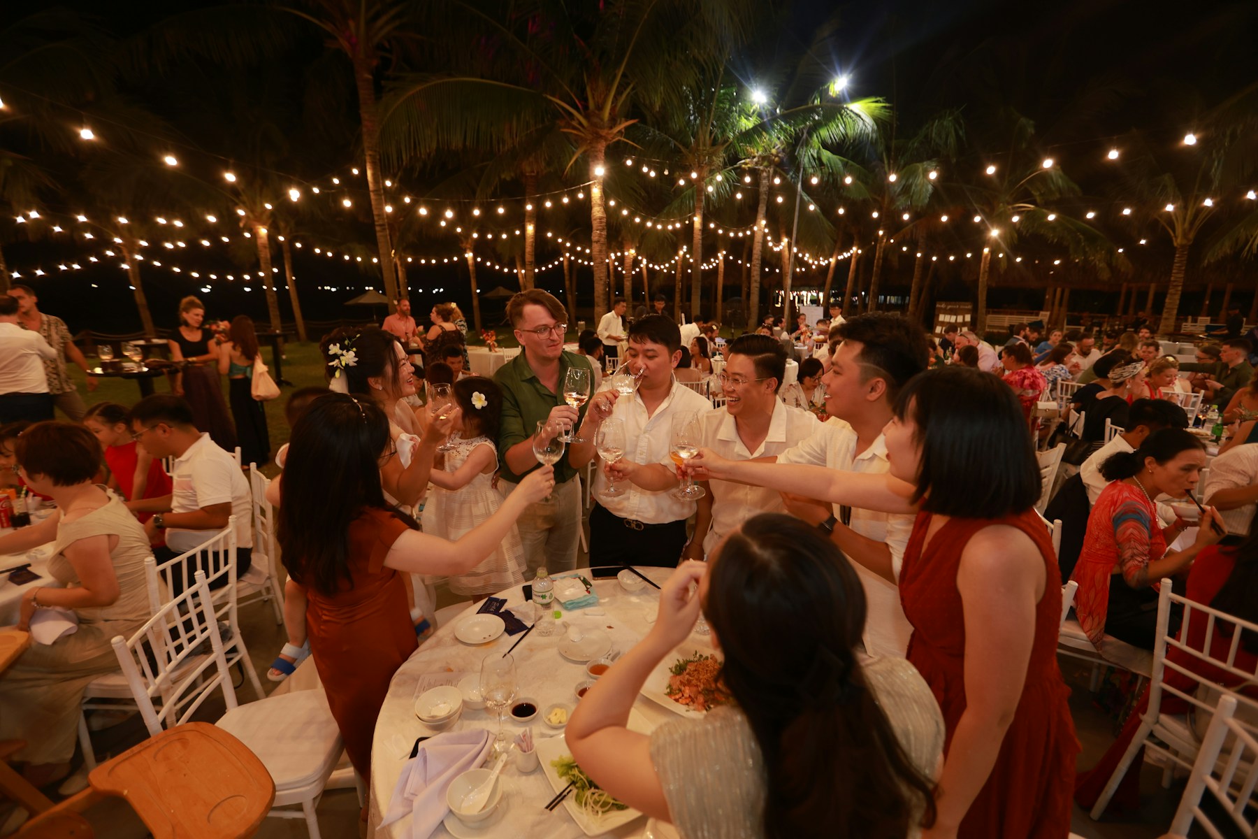 Guests celebrating together under the lights